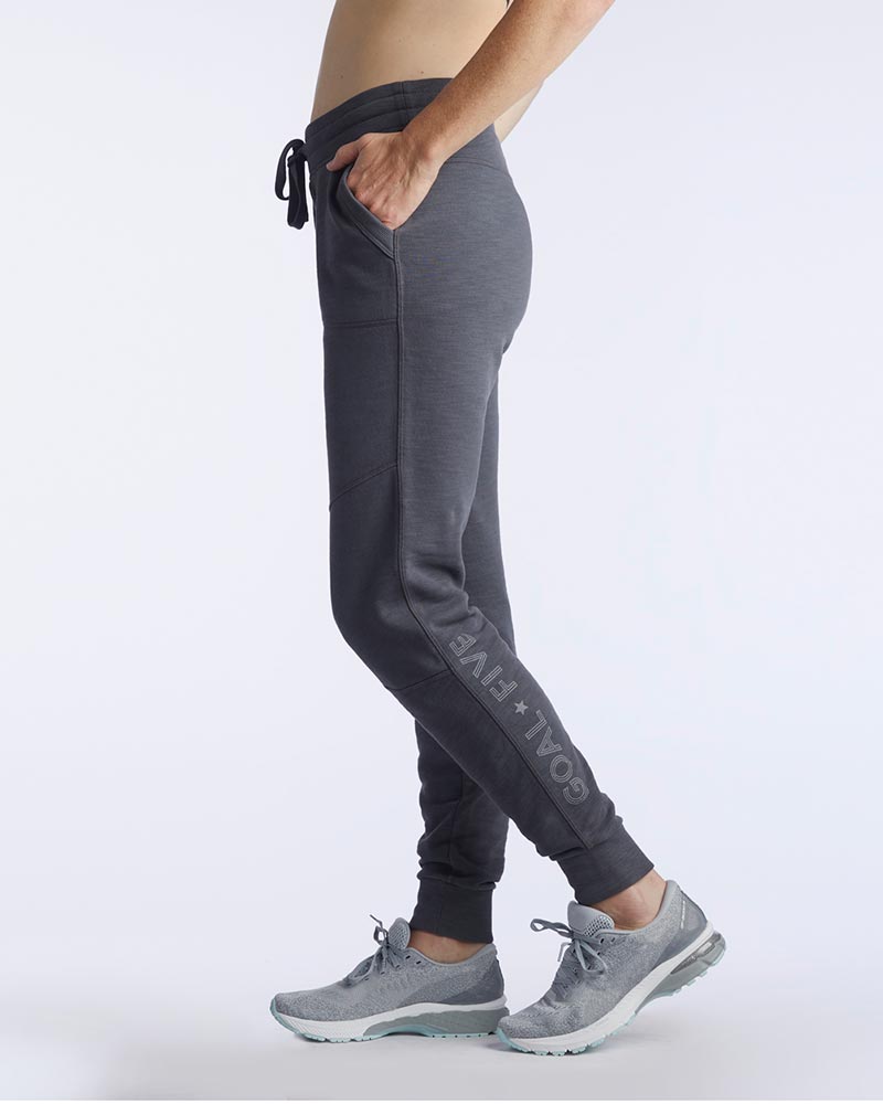 Goal Five Freasy Jogger in carbon color, lifestyle image showing side view of comfortable, stylish jogger pants.