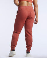 Back view of Goal Five Freasy Jogger in cinnabar color, showcasing its relaxed lifestyle fit and comfortable fabric.