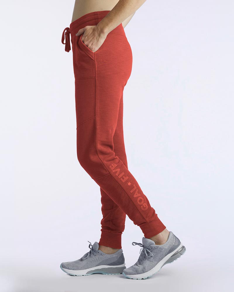 Goal Five Freasy Jogger in cinnabar color, lifestyle shot showing side view of comfortable jogger pants.