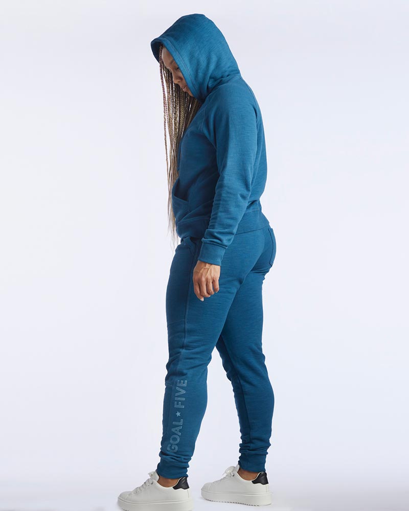Dark teal Goal Five Freasy Jogger lifestyle pants shown from the side, featuring a relaxed fit and casual style.