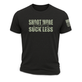 Front view of Bow Crew Apparel "Shoot More Suck Less" T-shirt featuring bold text on a casual black hunting lifestyle tee.