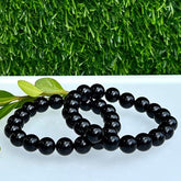 Onyx stretch bracelet with 10mm beads from Evermore Everlasting, featuring smooth black stones on an elastic cord.