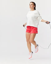 Goal Five G5 Advance 4.5-inch knit shorts in vibrant hot coral, featuring a comfortable elastic waistband and casual fit.
