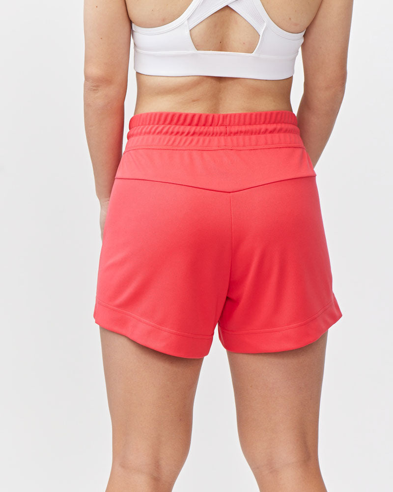 Goal Five G5 Advance 4.5-inch knit shorts in hot coral, showing the textured fabric and comfortable fit.