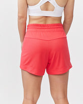 Goal Five G5 Advance 4.5-inch knit shorts in hot coral, showing the textured fabric and comfortable fit.