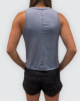 Goal Five blue boxy crop tank top shown from the back, featuring a relaxed fit and sleeveless design.