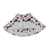 Maroon girl’s activewear skirt with a football bow design, suitable for kids and girls, by Mini Rodeo.