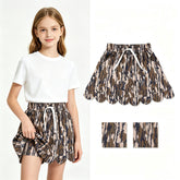 Olive camo pocket scallop girl skirt by Mini Rodeo, featuring a playful scalloped hem and practical side pockets for kids.