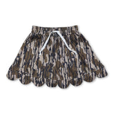 Olive camo pocket scallop girl skirt by Mini Rodeo, featuring a playful scalloped hem and functional front pockets for kids.