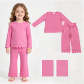 Hot pink cotton long-sleeve girl pajamas set with scalloped edges, including top and pants from Mini Rodeo.