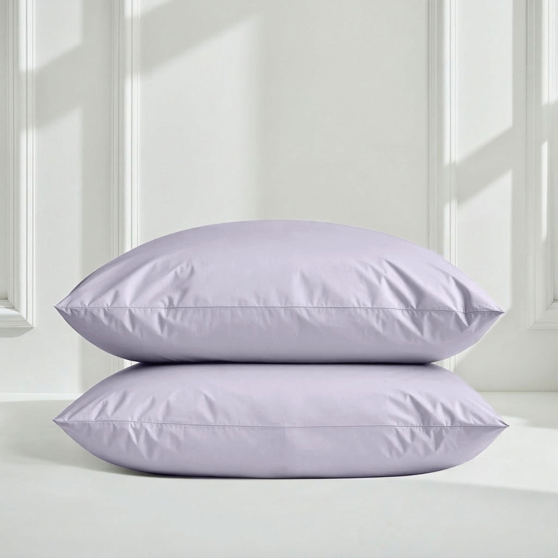 Italic Luxe Australian Sateen Sheet Set on a bed with white sheets and pillows in a cozy bedroom setting.