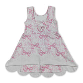 Pink sleeveless floral summer dress for girls by Mini Rodeo, featuring a bow and short sleeves, perfect for warm weather.