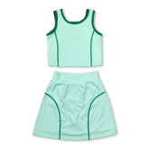 Light green sleeveless top and high-waist skirt set for girls, activewear by Mini Rodeo, featuring short sleeves and comfortable fit.