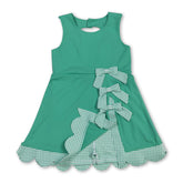 Green sleeveless plaid bow dress for girls by Mini Rodeo, featuring a summer athletic style with a short sleeve design.