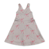 Pink bow summer athletic dress for girls by Mini Rodeo, short sleeve design with playful straps perfect for kids&