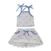 Light blue girl’s short sleeve top and skirt set with bow straps from Mini Rodeo, perfect for kids&