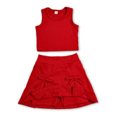 Red sleeveless girl’s active wear set with bow fold skirt and short sleeves by Mini Rodeo, perfect for active play.