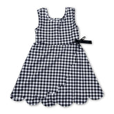 Sleeveless black plaid scallop athletic dress for girls by Mini Rodeo, featuring short sleeves and a playful scalloped hem.