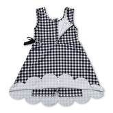 Black plaid scallop sleeveless athletic dress for girls by Mini Rodeo, featuring short sleeves and a playful scalloped hem.