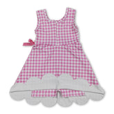 Pink plaid scallop sleeveless kids girls athletic dress by Mini Rodeo, featuring short sleeves and a playful scalloped hem.