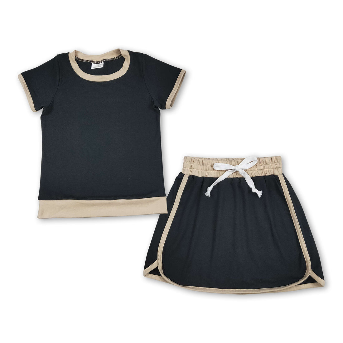 Black cotton girl’s short-sleeve top and skirt set from Mini Rodeo, perfect for summer kids&