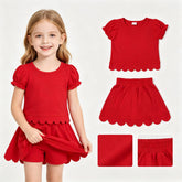 Red girl’s short sleeve scallop top and skirt summer set by Mini Rodeo, featuring a stylish scalloped design and comfortable fit.