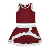 Maroon and white scallop girl active wear set by Mini Rodeo featuring sleeveless top and skirt for active girls.
