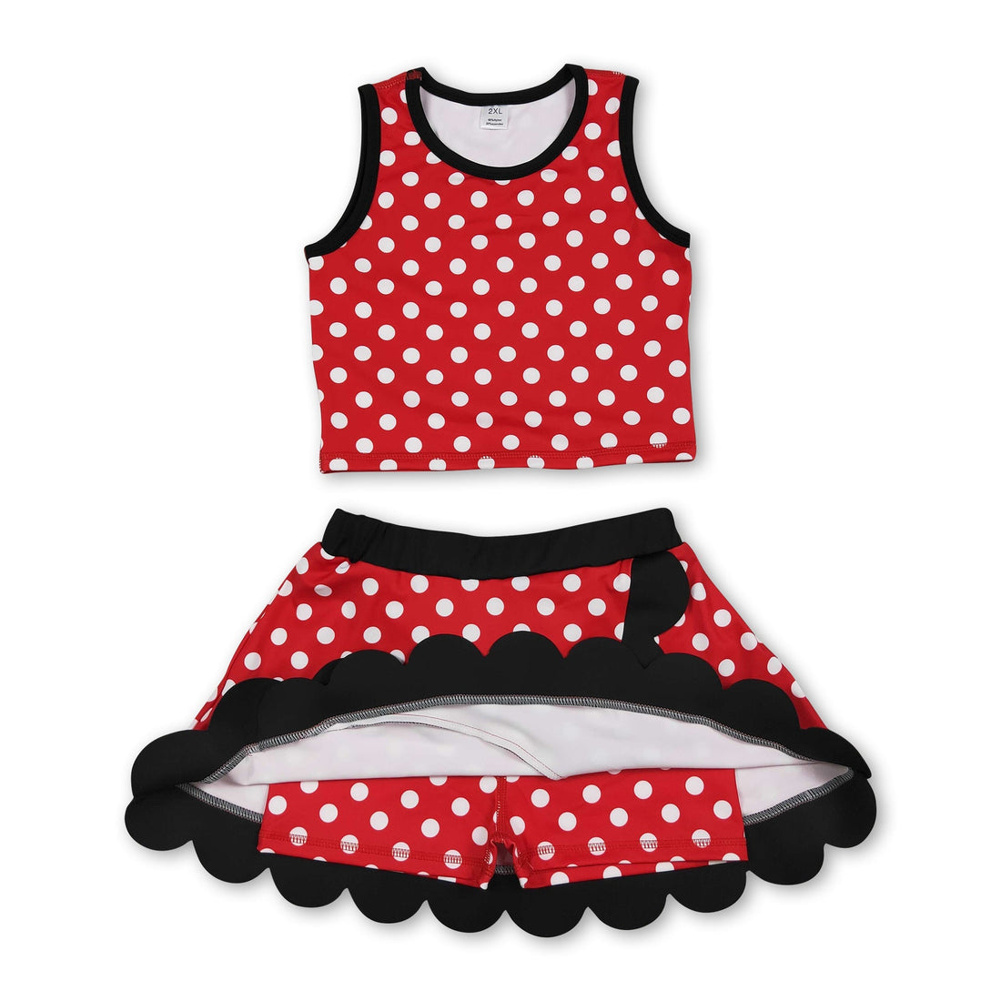 Red polka dots girl’s active wear set with scalloped short sleeve top and skirt by Mini Rodeo, perfect for active girls.