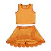 Yellow sleeveless dog scallop girl’s summer active wear set featuring a short sleeves top and skirt from Mini Rodeo.