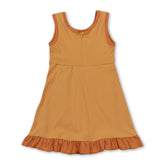 Yellow sleeveless scallop dog print kids girls athletic dress by Mini Rodeo, featuring a short-sleeve design with playful dog motifs.