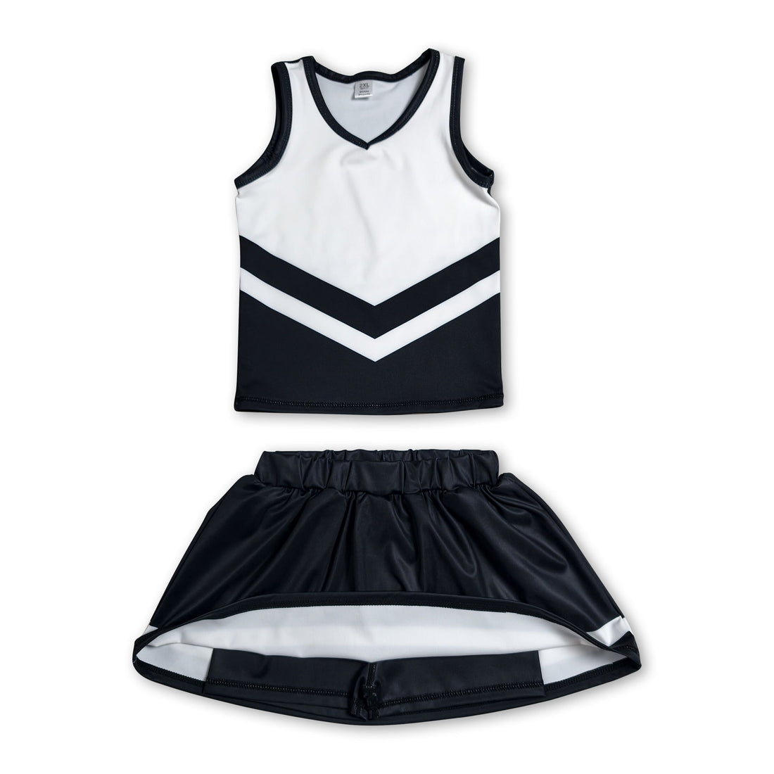 Girl in sleeveless white and black cheerleader top with matching skirt from Mini Rodeo active team set, front view.