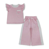 Pink polka dot girl short sleeves top and pants set by Mini Rodeo, featuring flutter sleeves and a playful, stylish design.