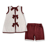 Mini Rodeo girl shorts set with ruffle top, bow hat, and western style boots, featuring short sleeves and a playful design.