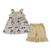 Girl short sleeves top and yellow plaid shorts set by Mini Rodeo, featuring a sleeveless farm ruffle tunic outfit for girls.