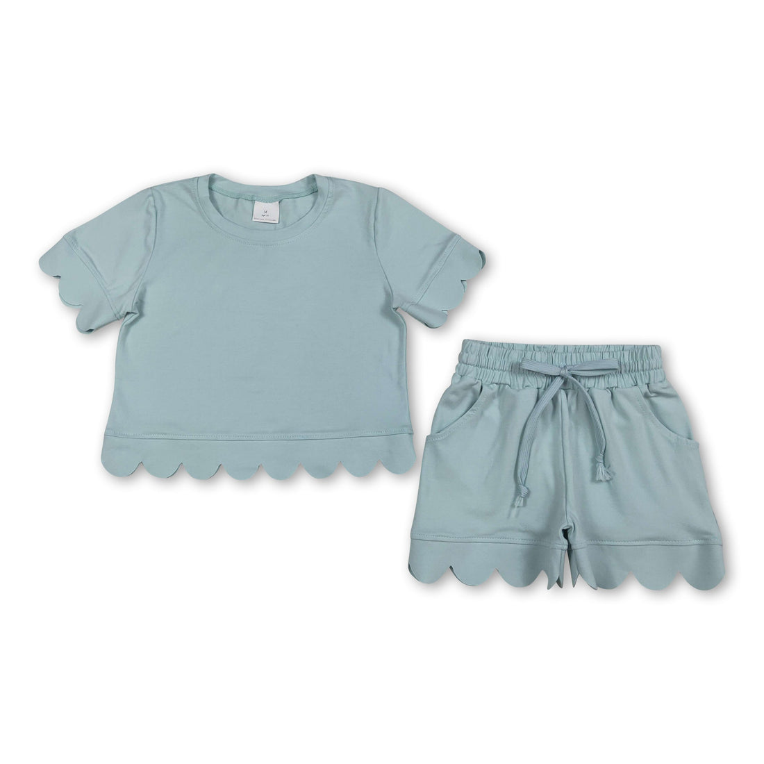 Sky blue girl’s short sleeves scallop top and shorts set by Mini Rodeo, perfect for summer play and warm weather.