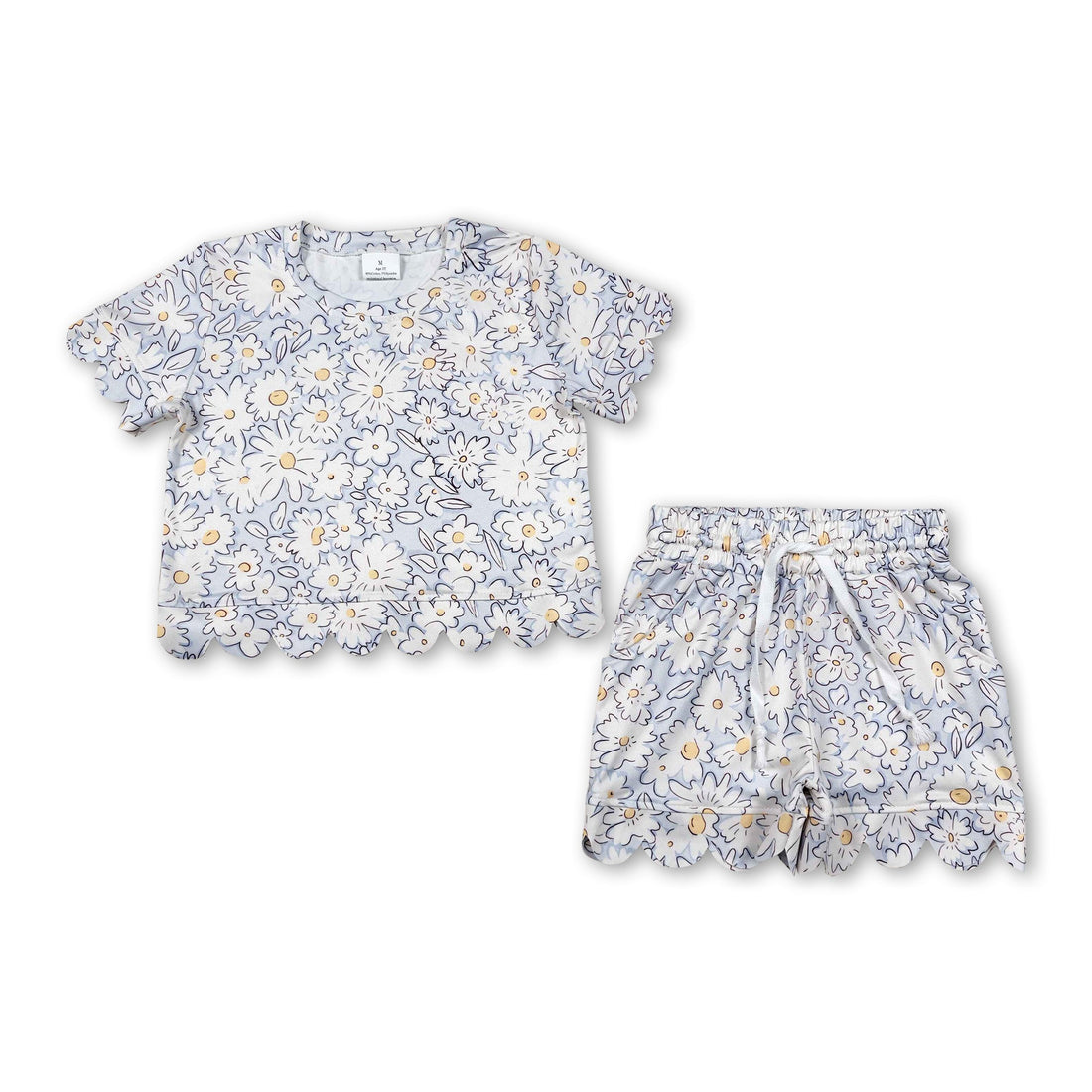 White floral toddler girls summer set with short sleeves and scallop details, includes top and shorts, by Mini Rodeo.