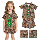 Green camo girl short sleeves top and shorts pajamas set with bow detail by Mini Rodeo, perfect for comfortable bedtime wear.