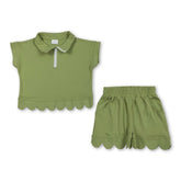 Green scallop pullover and shorts set for girls by Mini Rodeo, featuring a short-sleeve top and matching summer shorts.