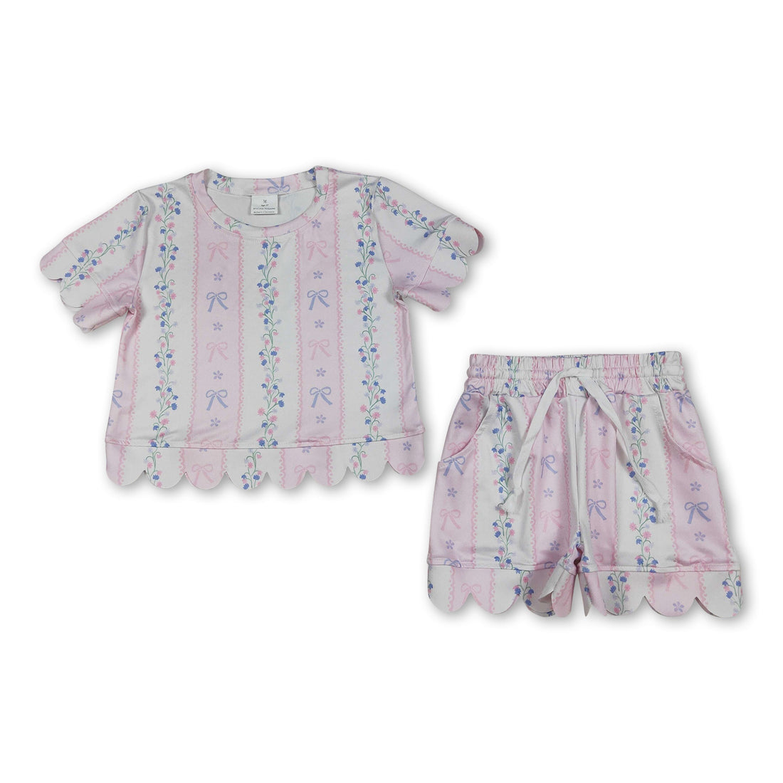 Pink floral scallop top and shorts set for girls with short sleeves and bow detail, by Mini Rodeo.