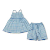 Blue plaid girl shorts set with short sleeves from Mini Rodeo, featuring a comfortable tunic and matching shorts for kids.