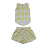 Girl sleeveless yellow plaid top and shorts set by Mini Rodeo, perfect for active wear, featuring a stylish short-sleeve design.