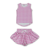 Girl sleeveless pink plaid top and shorts set from Mini Rodeo, perfect for active wear and casual outings.