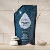 Puracy gel hand soap in a refill pouch, showing clear gel formula and pump dispenser for hand cleaning and hygiene.