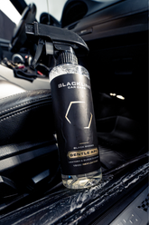 Blackline Car Care BLACKLINE® Gentle APC all-purpose cleaner applied to a car door sill for cleaning and detailing.