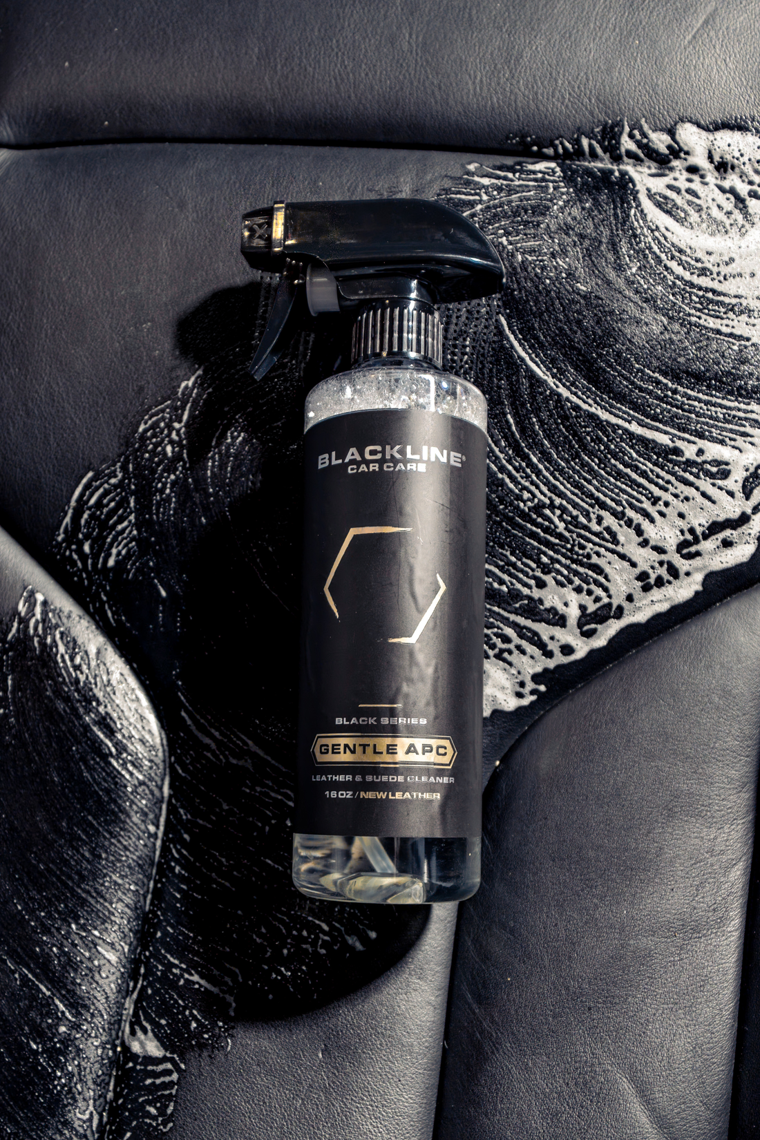 Blackline Car Care BLACKLINE® Gentle APC all-purpose cleaner being sprayed on a car surface for cleaning.