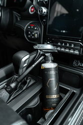 Blackline Car Care BLACKLINE® Gentle APC all-purpose cleaner spray in a lifestyle setting, suitable for cleaning various surfaces.