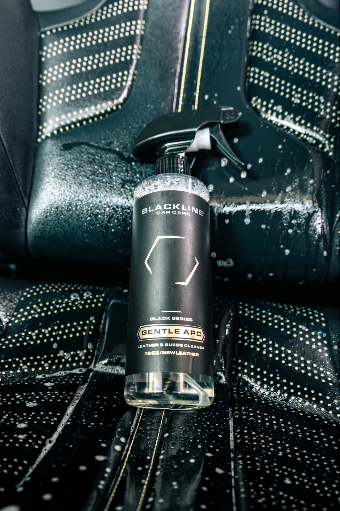 Blackline Car Care BLACKLINE® Gentle APC all-purpose cleaner applied to a car seat for gentle cleaning and stain removal.