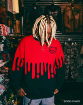 Gloomy Drip Knit Sweater by Any Means Necessary Clothing, featuring a dark, moody knit design with a relaxed fit.