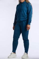 Dark teal Goal Five Freasy Jogger in lifestyle setting, showcasing comfortable fit and stylish design.