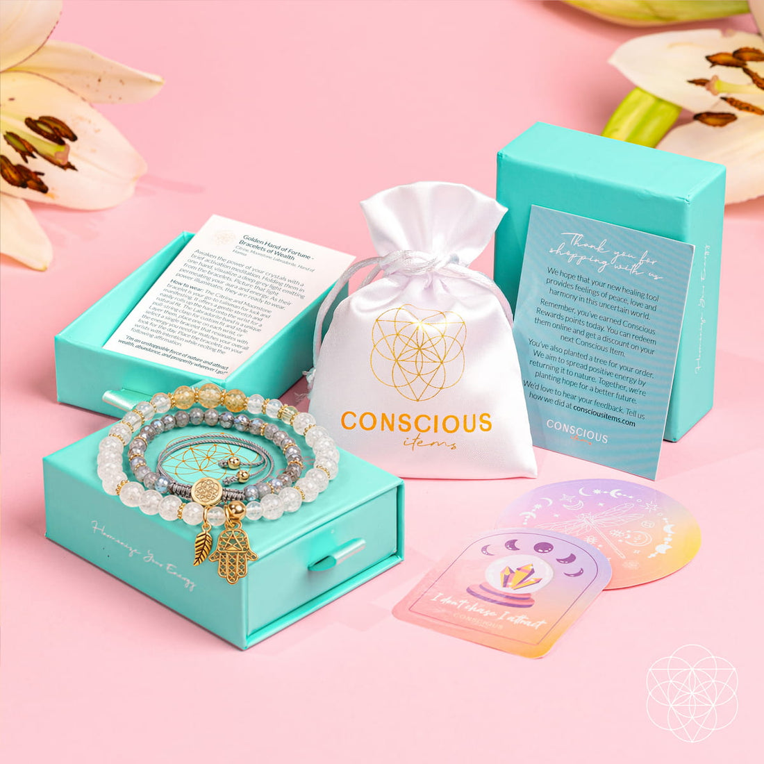 Golden Hand of Fortune jewelry set with bracelets of wealth in sleek packaging, featuring intricate gold designs from Conscious Items.